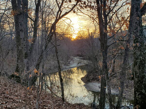winter sunset over creek